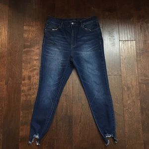 Skinny fray bottom ripped jeans.